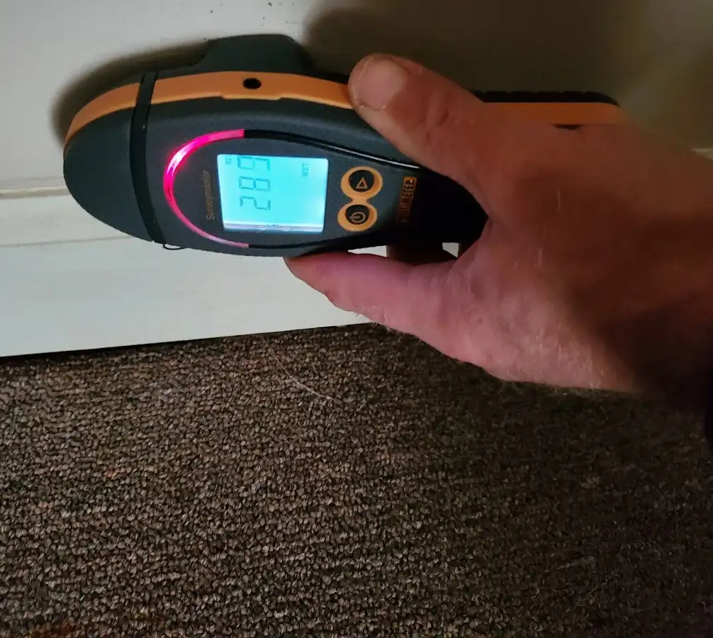 Moisture detection at baseboard during Burst Pipe Cleanup in White City